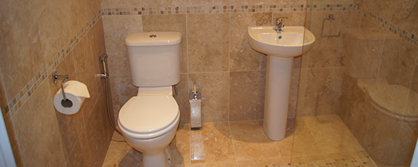 Bathroom with beige coloured decoration